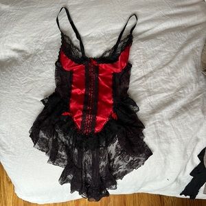SEXY LACE top with red statin and bows.
